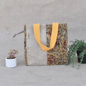 Yellow kalamkari and jute lunch bag