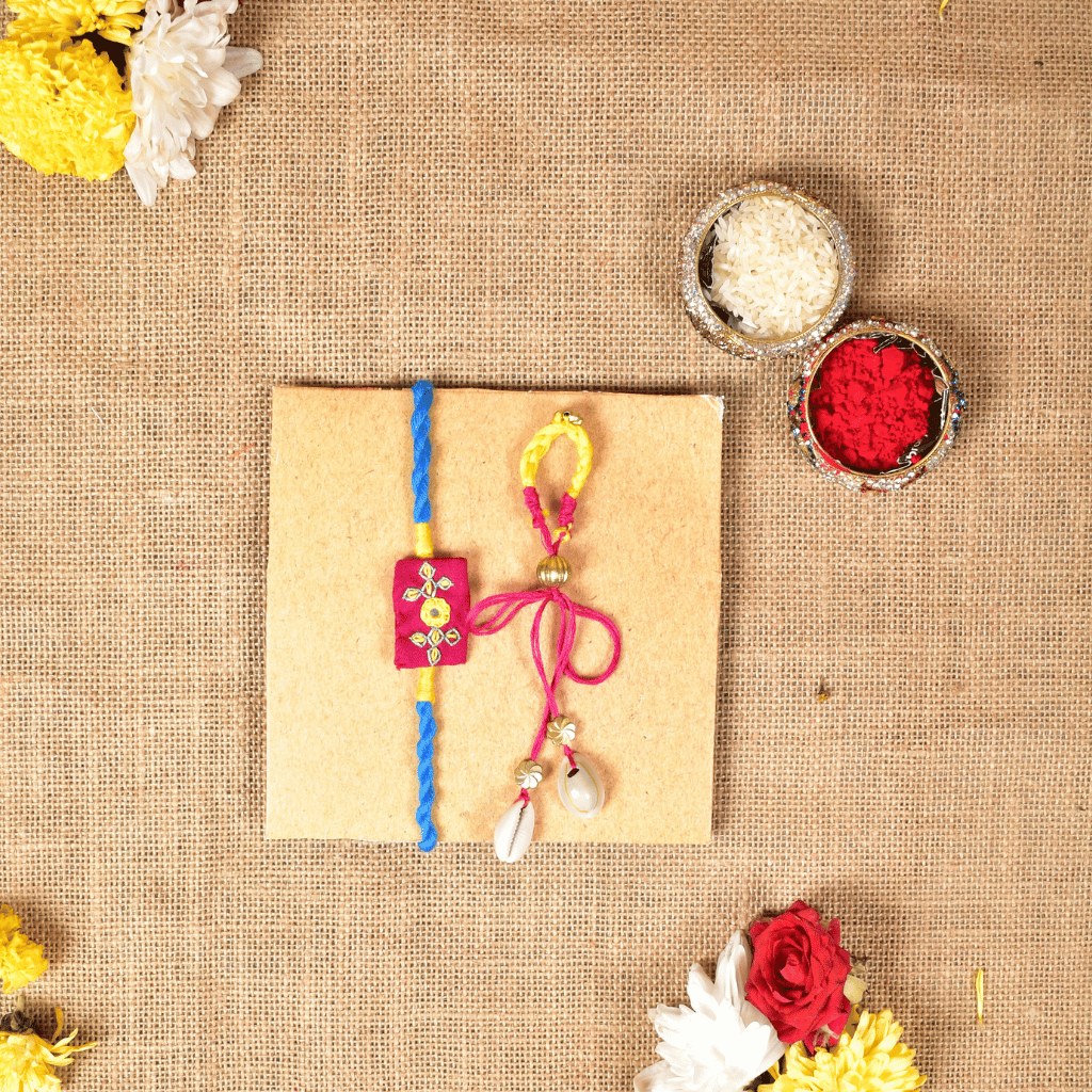 Handcrafted Bhai Bhabhi Rakhi Set with Cotton Potli, Kumkum & Rice - Pink