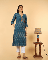 A symmetric Teal Blue Ikat Embroidery Kurta - pocket
