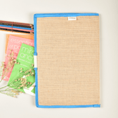 Simple natural jute file folder with a velcro tab and blue piping - back