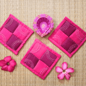 Set of 4 embroidered fabric coasters in pink & maroon