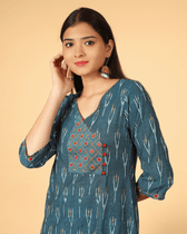 A symmetric Teal Blue Ikat Embroidery Kurta - neck
