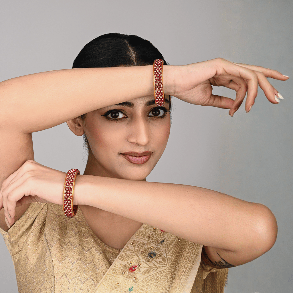 Pair of broad bangles in red and golden tones - Hyderabad