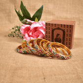 Set of eight bangles in pink & white tones