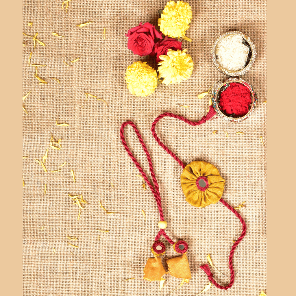 Handcrafted Bhai Bhabhi Flower Rakhi Set with Cotton Potli, Kumkum & Rice - Yellow