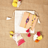 Handcrafted Bhai Bhabhi Rakhi Set with Cotton Potli, Kumkum & Rice - Blue