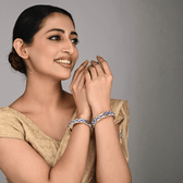 Pair of broad bangles in white and blue tones 