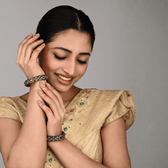 Pair of broad lac bangles in golden and black tones