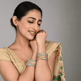 Set of  eight bangles in gold & blue tones - Hyderabad
