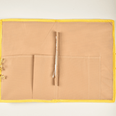 Simple natural jute file folder with a velcro tab and yellow piping - pockets