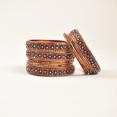 Pair of lac bangles in red & green stones