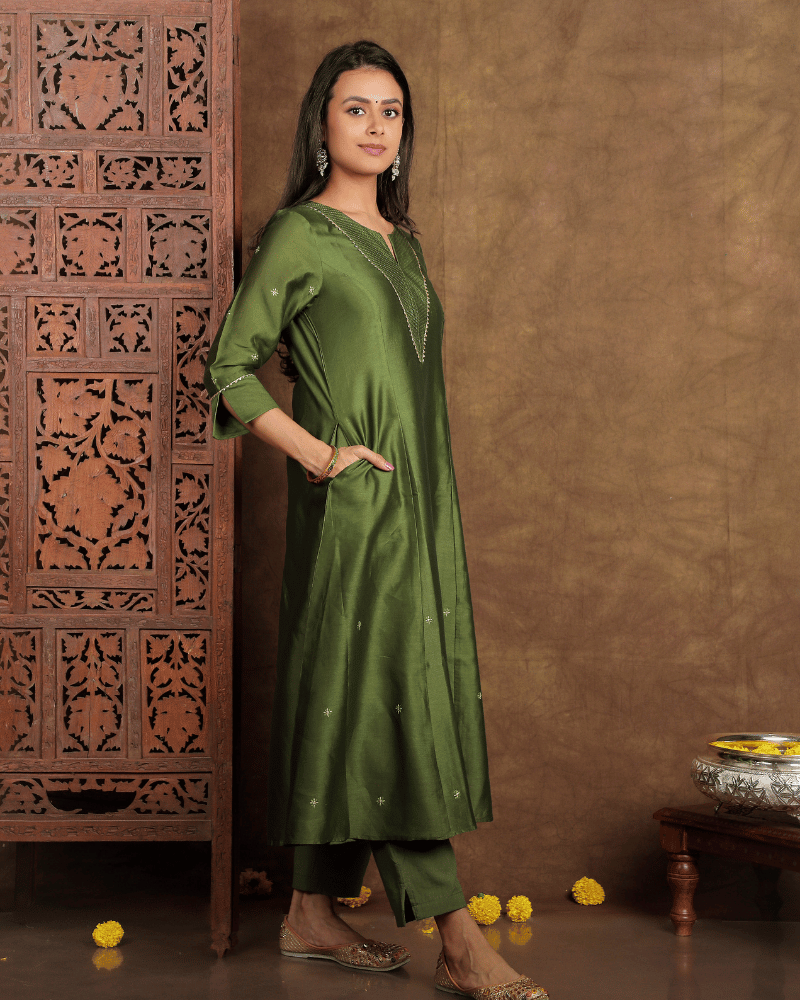 Fida A line Chanderi Silk Kurta and Pant Set with a v shaped yoke  and kalis in Moss Green