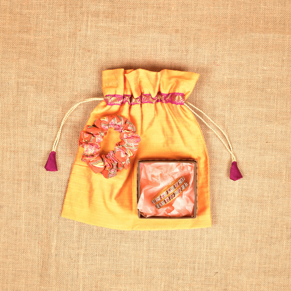 Festive return gift set - Lac bangles and scrunchie in a silk potli
