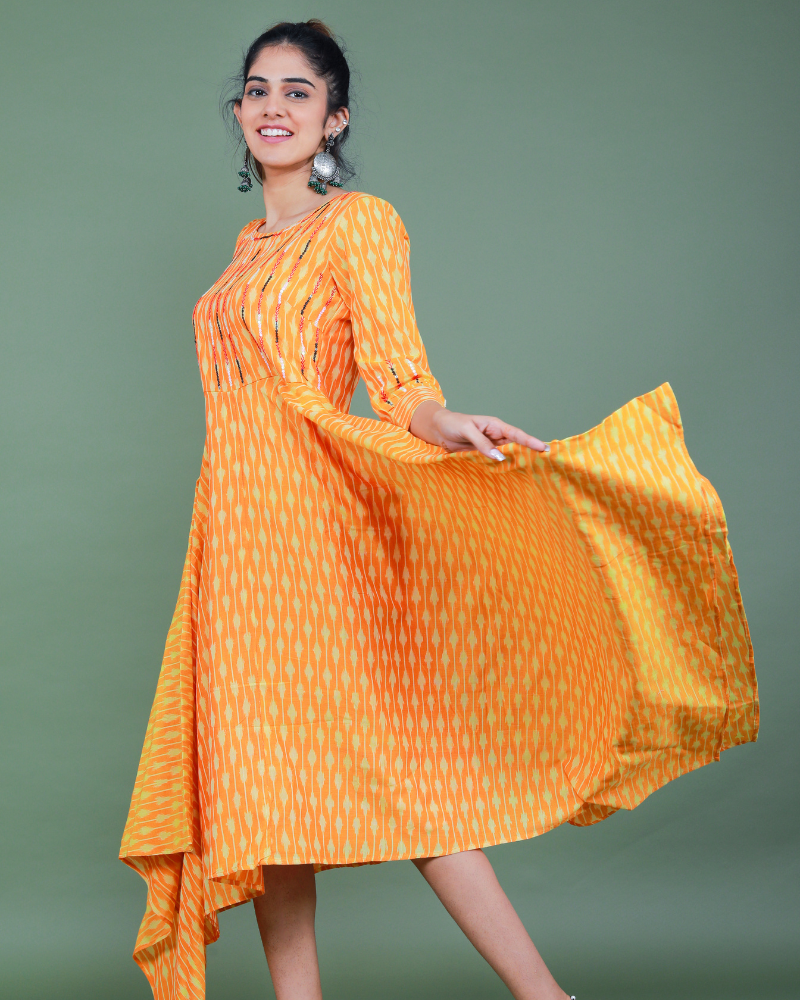 Golden yellow semi silk ikat dress with a handkerchief hem