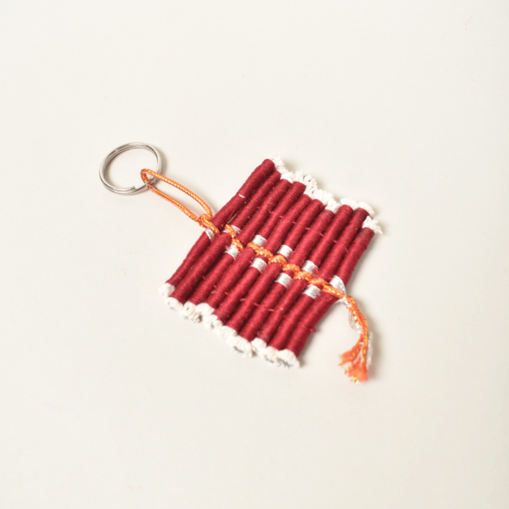 Handmade fabric keychain shaped like Diwali Ladi cracker – festive accessory