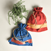 Handloom Potli With Tassels & Contrast Lace