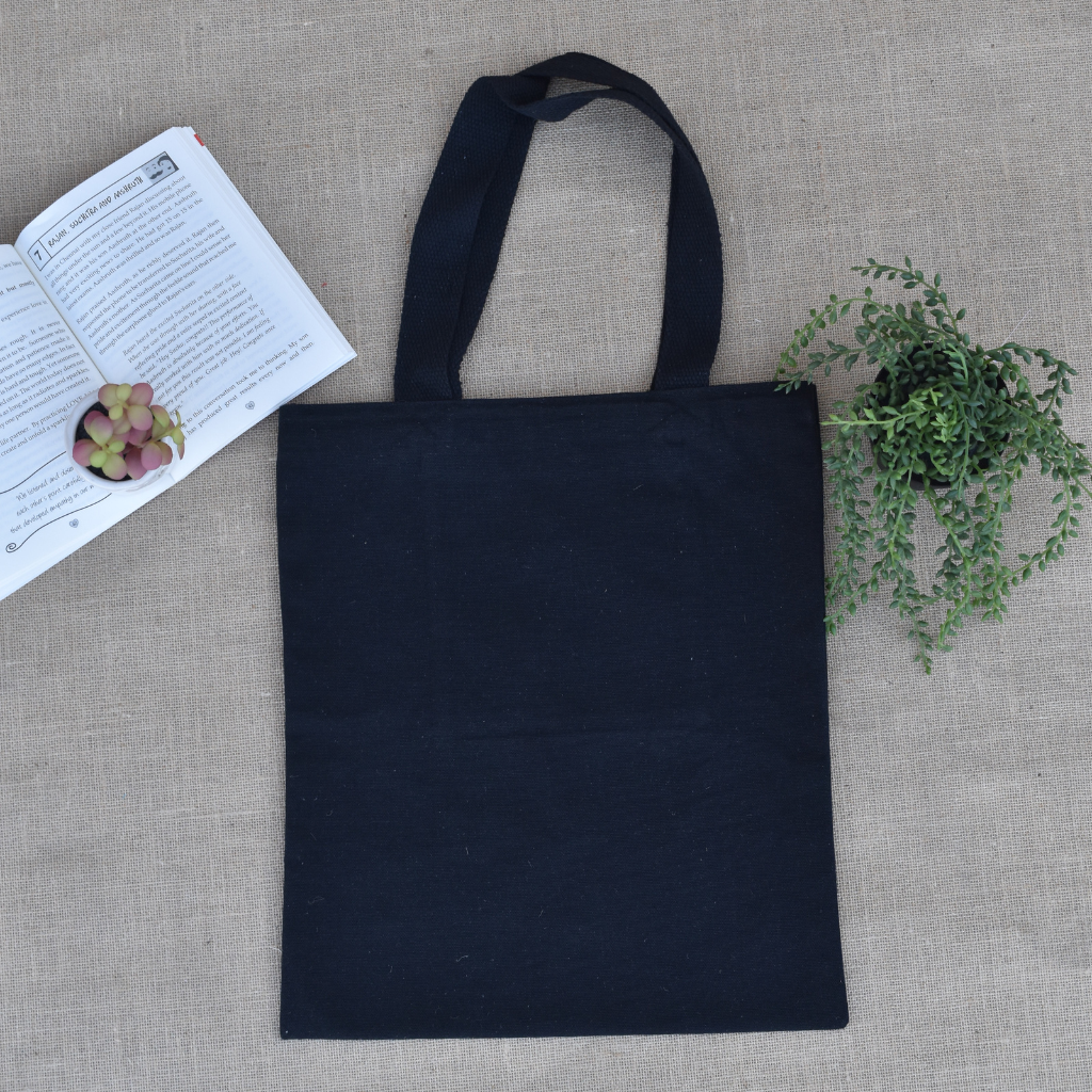 Black canvas tote bag with small flower embroidery