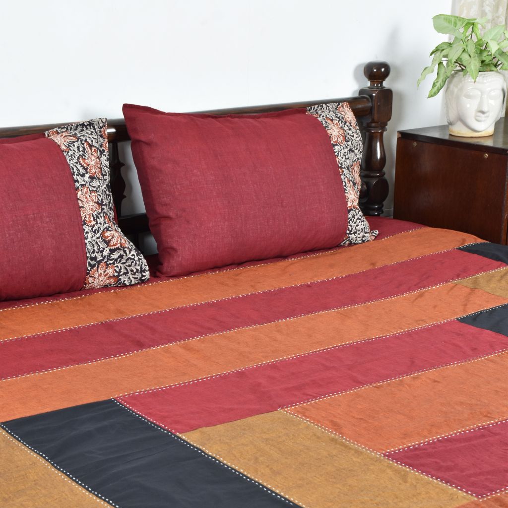 Kalamkari patchwork reversible double bedcover in maroon and black