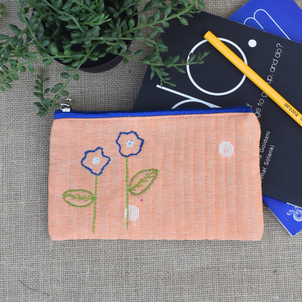 Light orange hand embroidered pouch