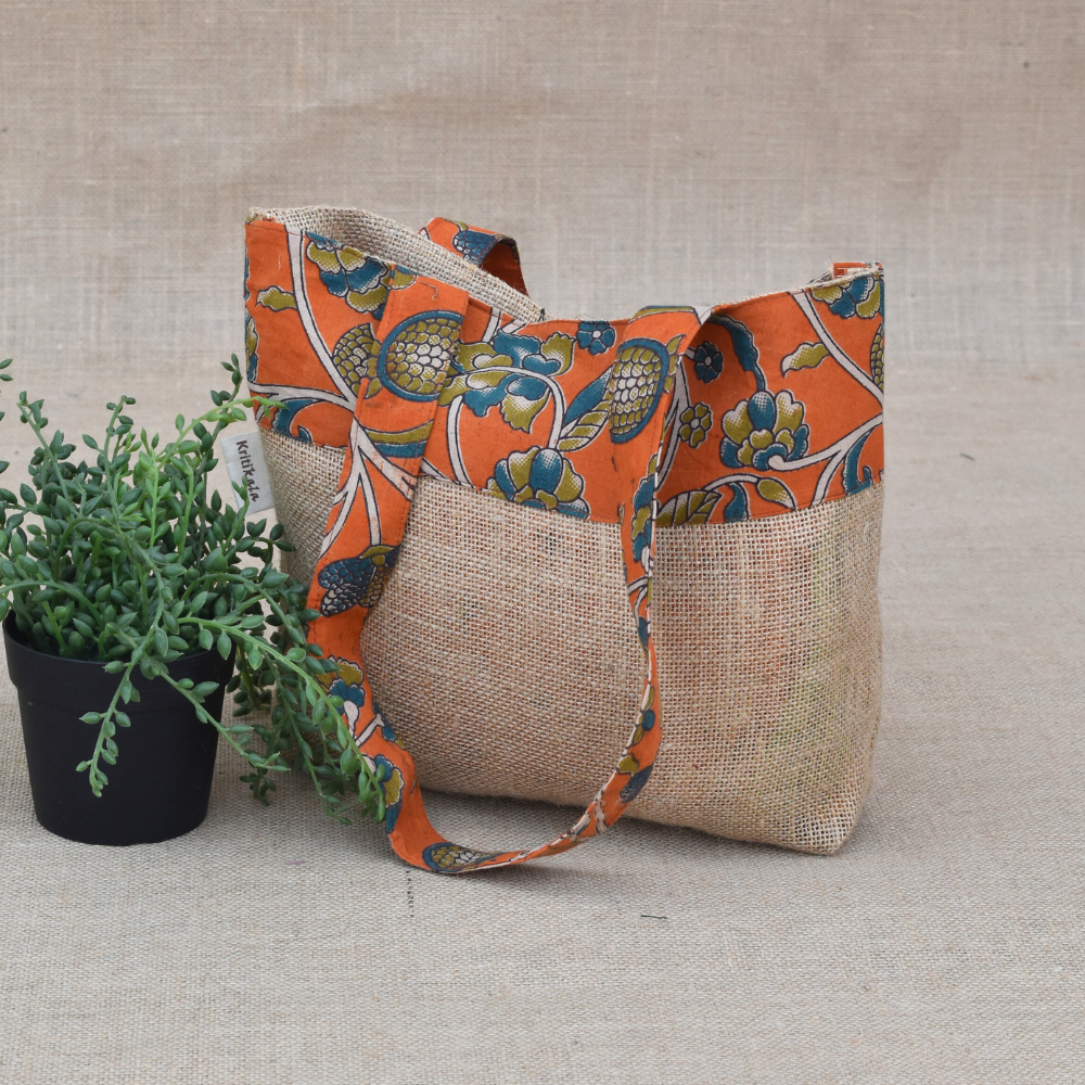 Soft jute tambulam or gift bag with orange Kalamakri print
