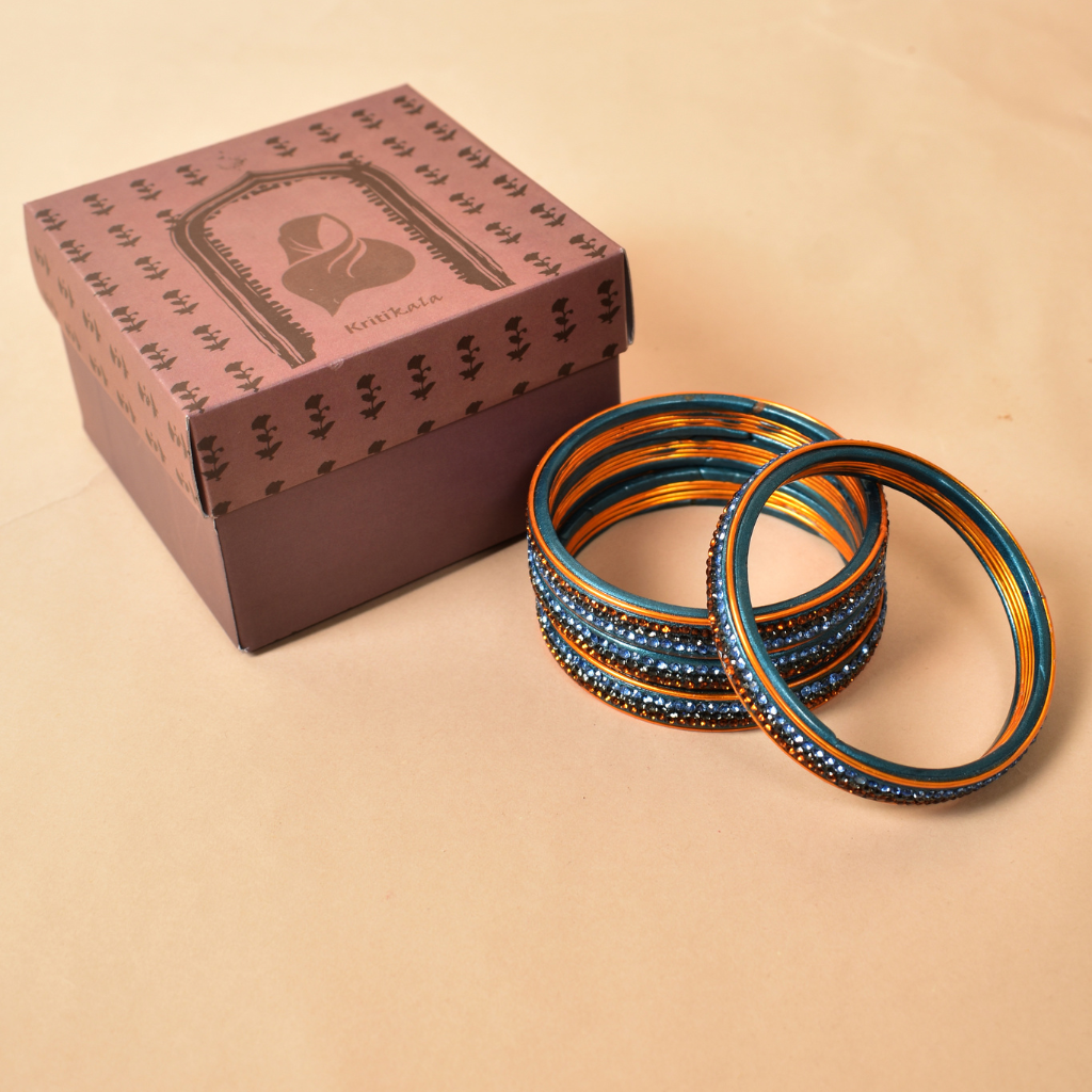 Pair of bangles with blue and golden stones