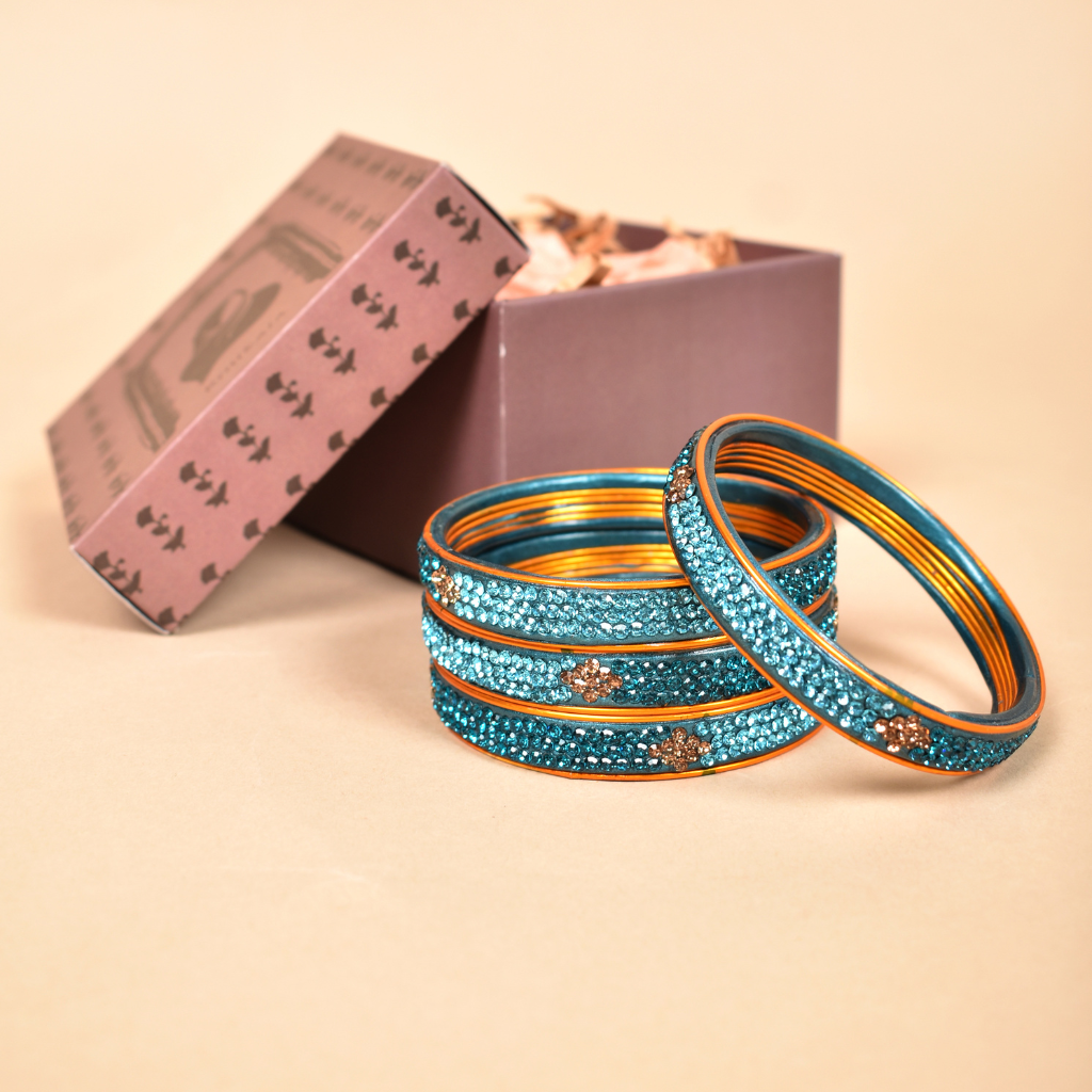 Pair of blue stone studded lac bangles