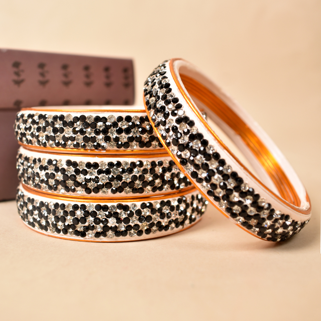 Pair of broad bangles in black and white tones