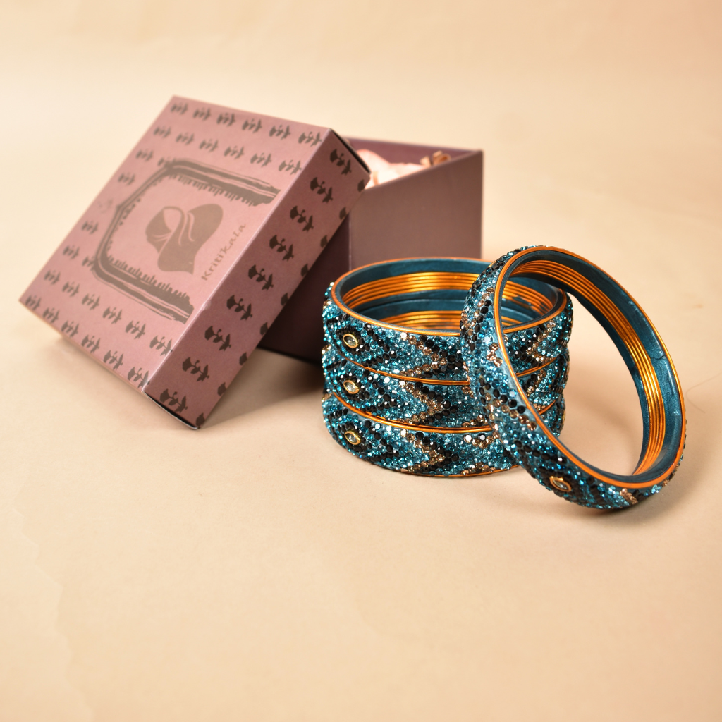 Pair of broad bangles in blue and black tones
