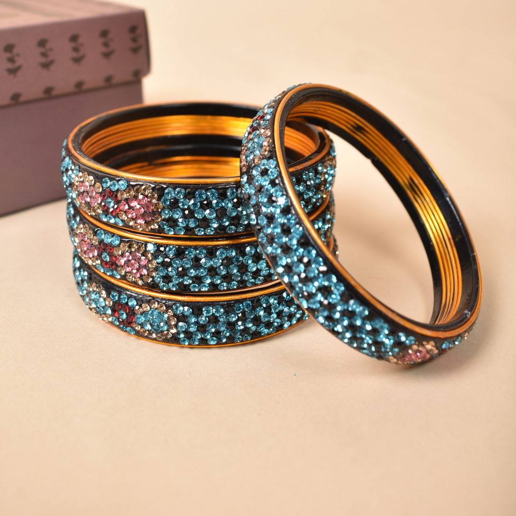 Pair of broad bangles in blue and black tones