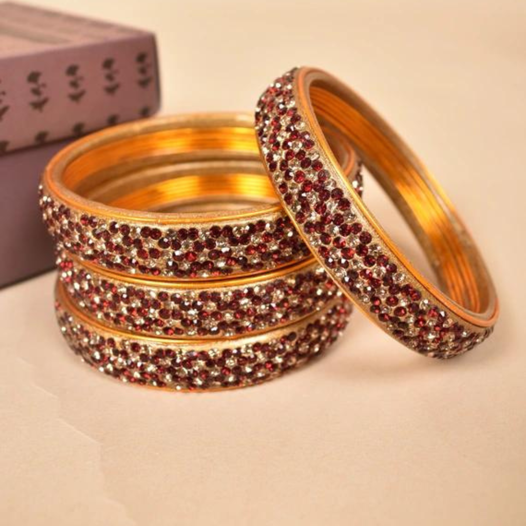 Pair of broad bangles in red and golden tones