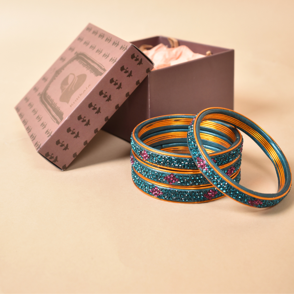 Pair of lac bangles in blue and pink stones