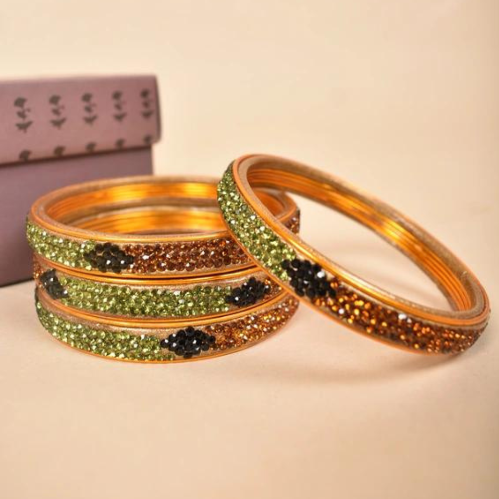 Pair of stone studded lac bangles in golden green tones