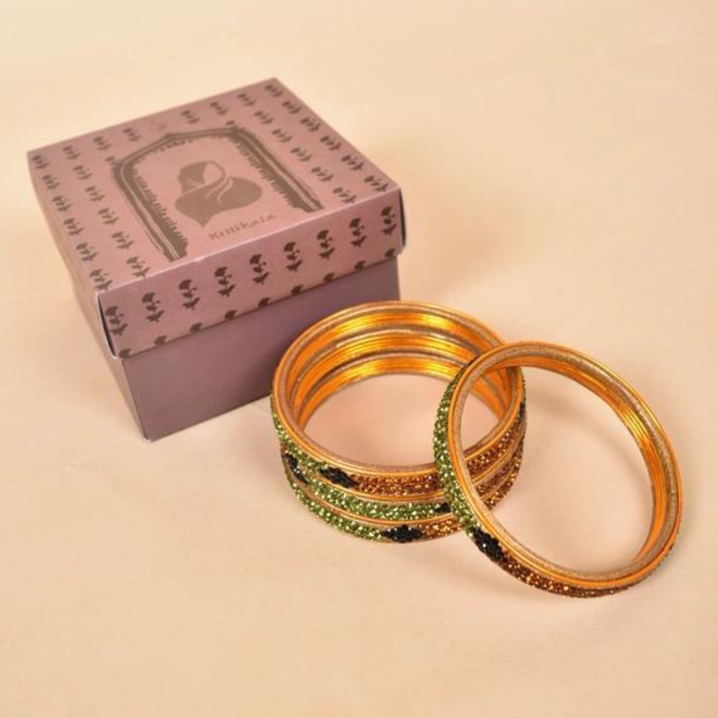 Pair of stone studded lac bangles in golden green tones