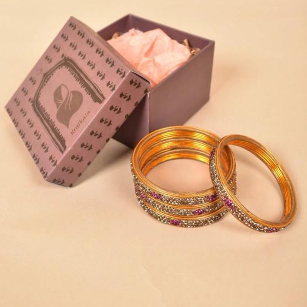 Pair of traditional lac bangles in golden tones
