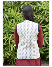 Reversible quilted jacket in blue and white ikat - back
