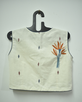 Off-white saree blouse with orange flower motif - back