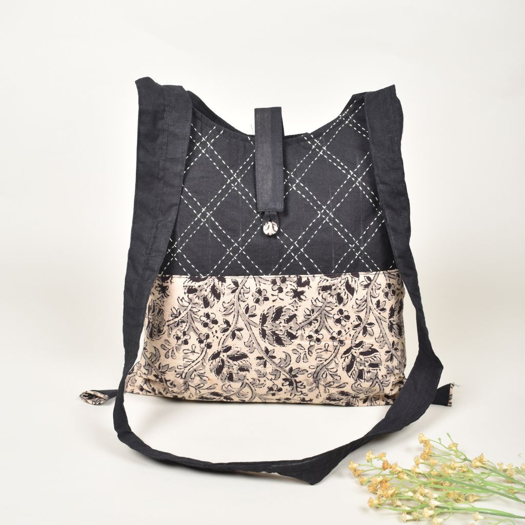 Handblock printed sling bag in black and white with embroidery design