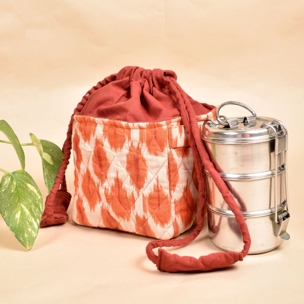 Gift hamper potli cum lunch bag in Orange ikat cotton