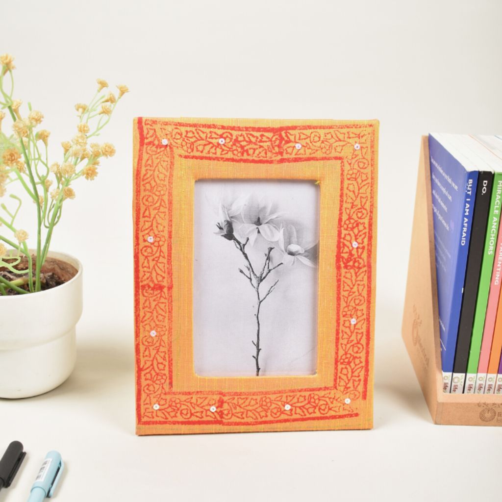 Photo frame for 4" x 6" photo with yellow embroidered fabric covering