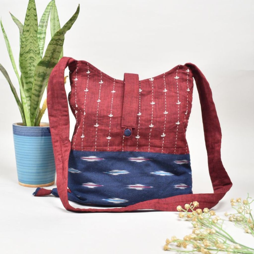 Handblock printed sling bag in blue and maroon with embroidery design