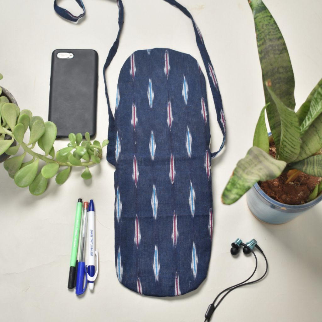 Multi-pocket sling bag in blue ikat cotton