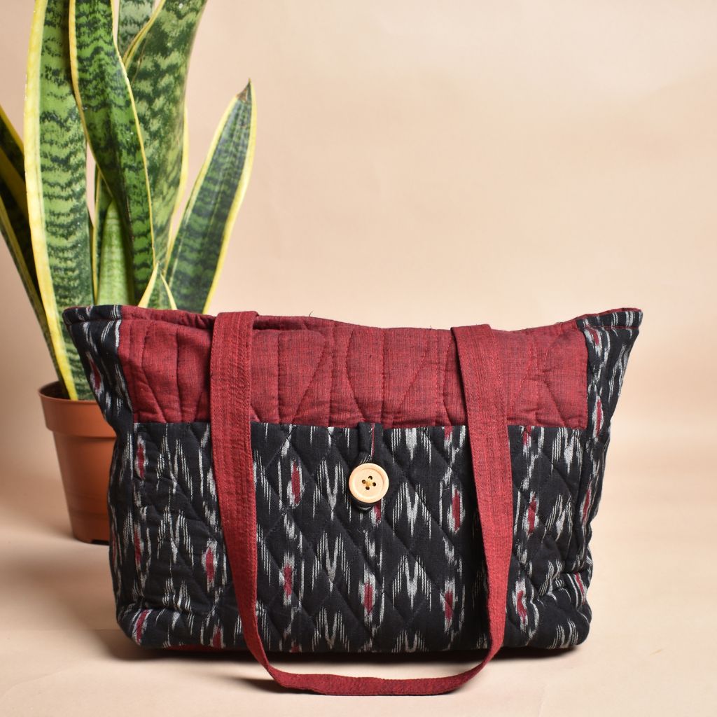 Quilted handbag in balck and red ikat with multiple pockets 