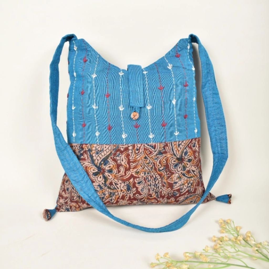 Handblock printed sling bag in blue and red with embroidery design